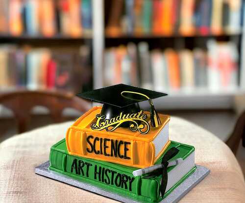 Graduation Hat on Stacked Books